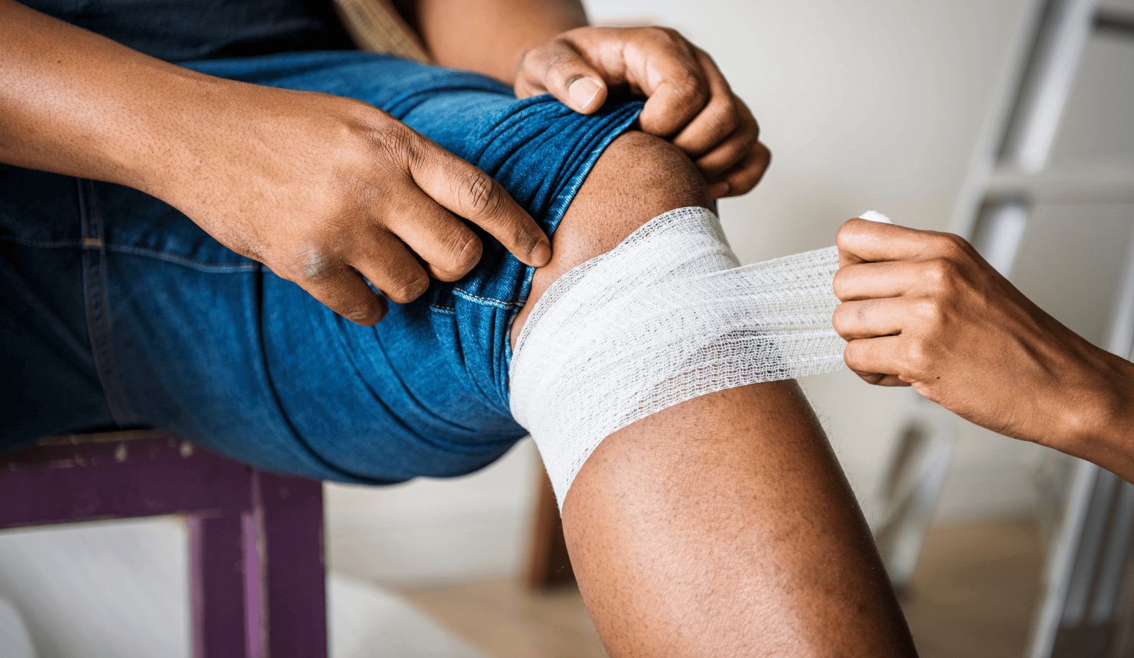 Nurse changing wound dressing